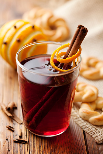 Warm red wine with spices and orange, served with cookies