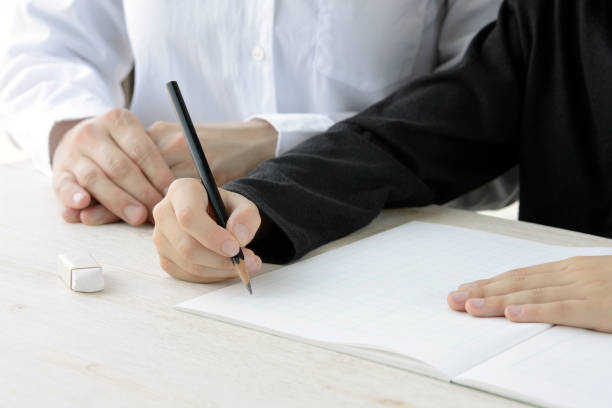 istock Child studying Chinese letters with mother 1148356477