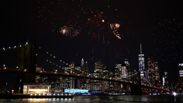 4K: Fireworks over Brooklyn Bridge in New York City at night