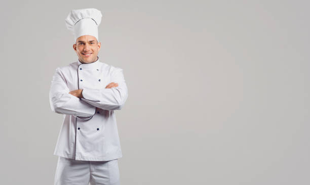 istock Smiling man in uniform of cook 1148358169