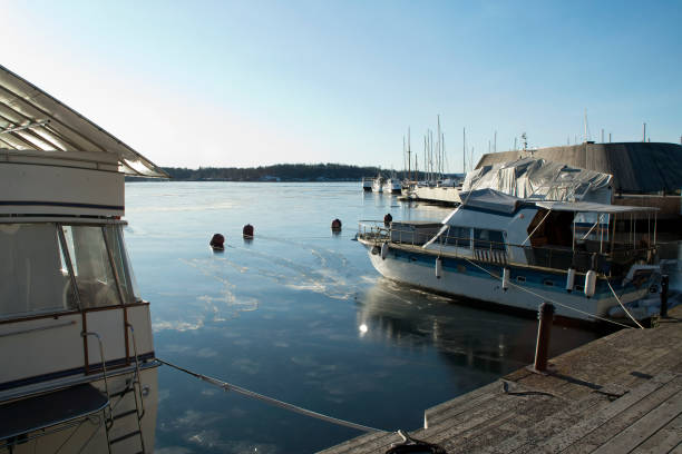istock Moored pleasure boat on icy harbour 1148362494