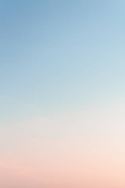 istock Beautiful sunset sky with feathery pink clouds in spring 1148364837