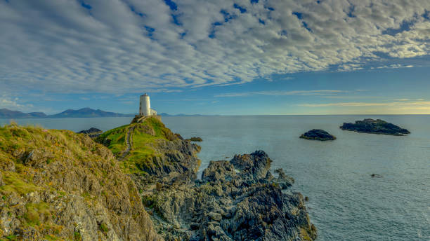 istock Evening light on Twr Mawr Light House on Llanddwyn Island, Anglesey, UK 1148365622