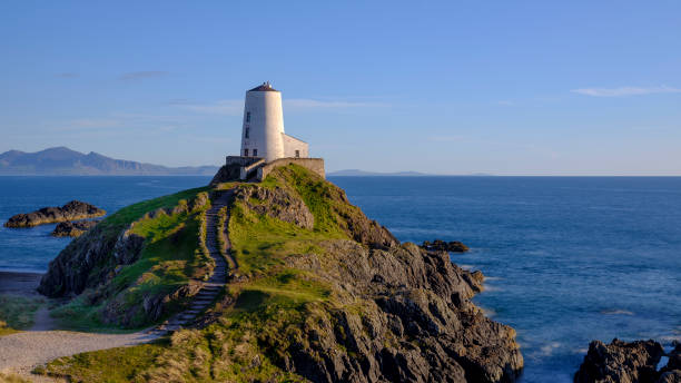 istock Evening light on Twr Mawr Light House on Llanddwyn Island, Anglesey, UK 1148365629