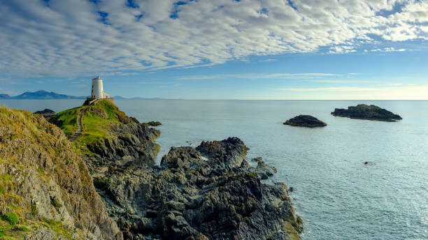 istock Evening light on Twr Mawr Light House on Llanddwyn Island, Anglesey, UK 1148365649