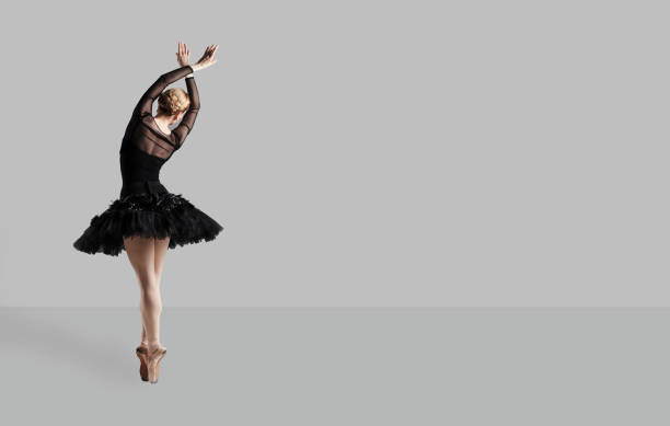 istock Ballerina ballet dancer over gray background. 1148367886