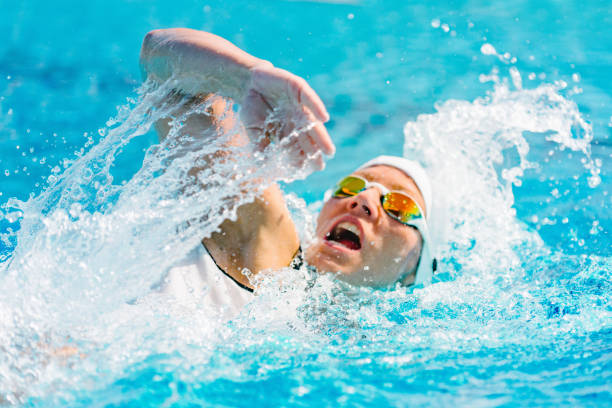 istock Woman Swimming In Pool 1148368015