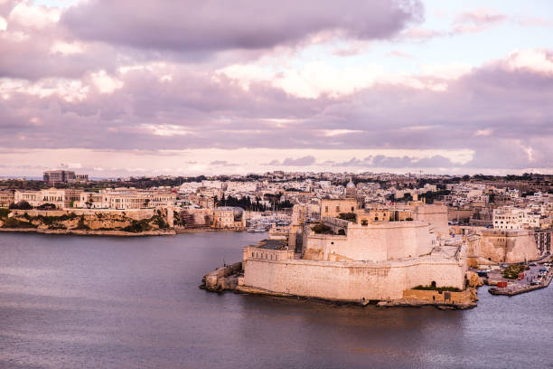istock Valletta panoramic view, evening time and purple sunset, Malta island. 1148369120