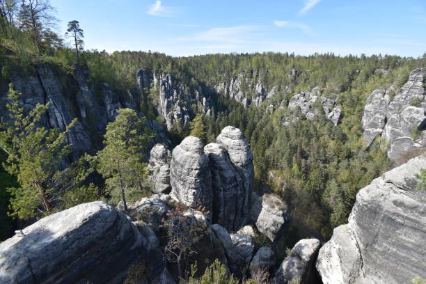 istock Big grey rocks with mountains and trees in background at Elbe Sandstone Mountains in beautiful Saxon Switzerland near Bohemian Switzerland in Germany 1148369629
