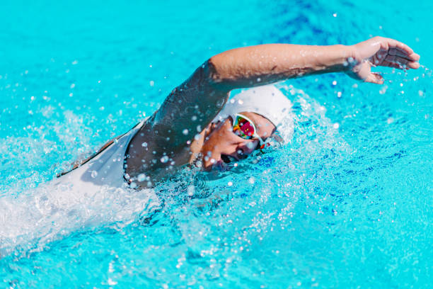 istock Woman Swimming In Pool 1148375334