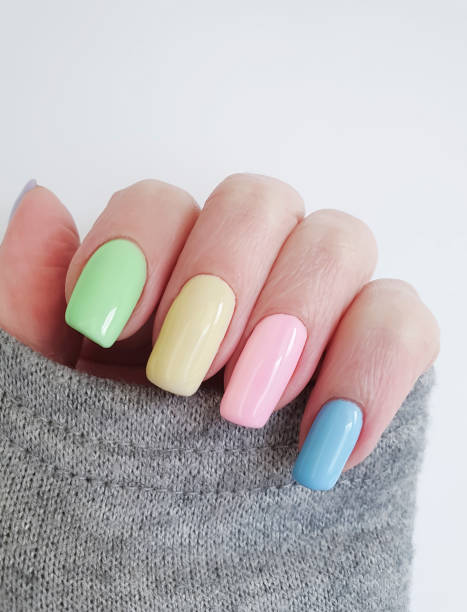 istock female hand beautiful manicure sweater 1148376587