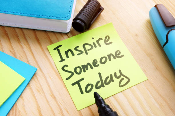 istock Quote Inspire someone today on desk. Inspiration concept. 1148379497