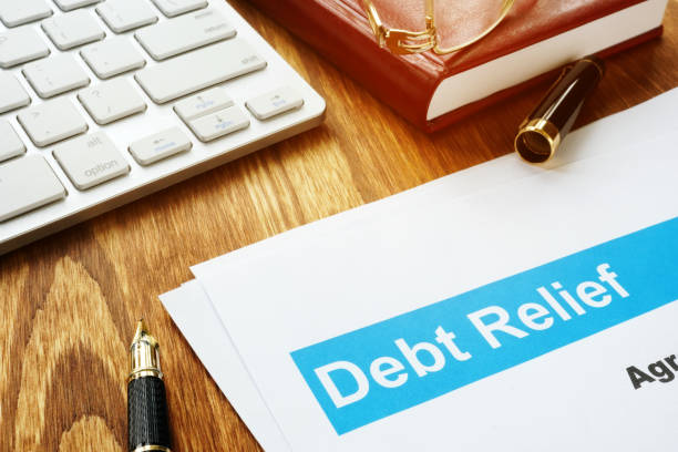 istock Debt relief agreement in an office on a desk. 1148380039