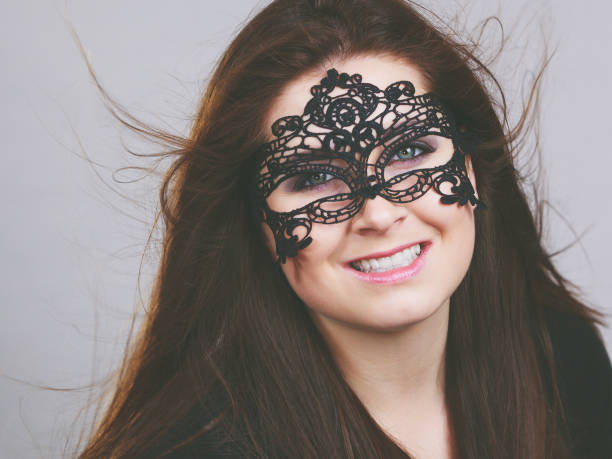istock Mysterious woman wearing lace mask 1148381768