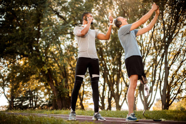 istock Adaptive athlete taking a selfie on a mobile phone with his multi-ethnic friend while he is having a phone call 1148382078