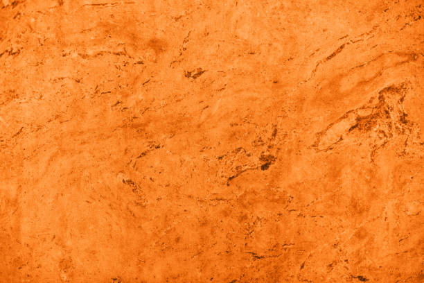 istock Close up of abstract turmeric orange toned granite stone texture 1148385867