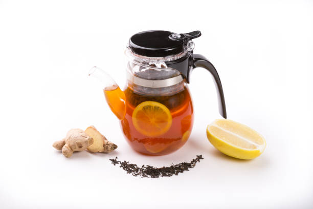 istock Glass transparent teapot on white backgrounf with tea ingredients 1148386062