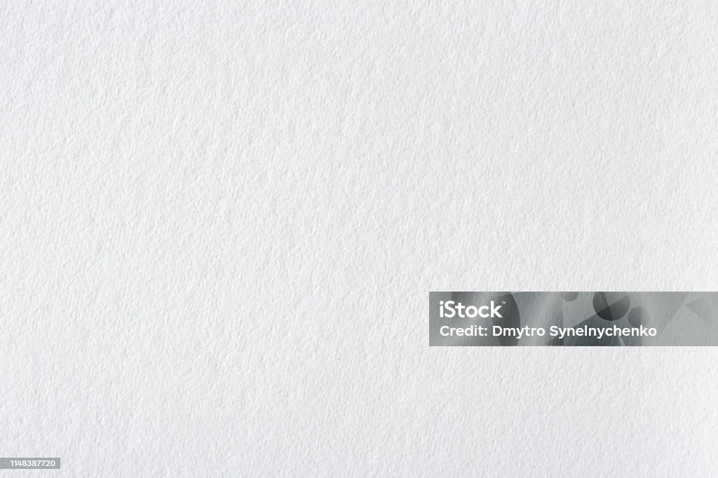 Background from white paper texture. Bright exclusive background, pattern close-up. Background from white paper texture. Bright exclusive background, pattern close-up. High resolution photo. Textured Stock Photo