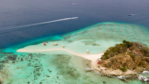 istock Small torpic island with a white sandy beach, top view 1148388018