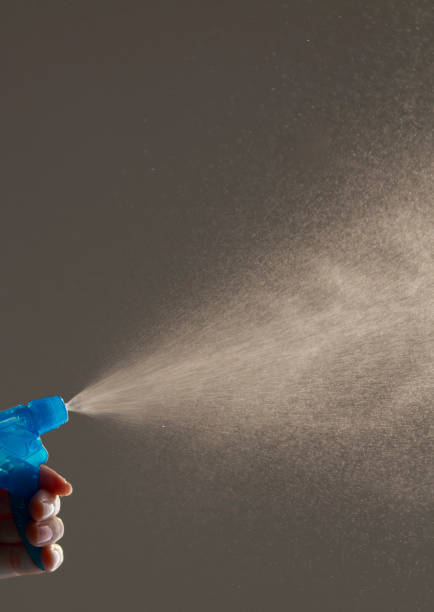 istock Hand hold bottle spraying water 1148389460