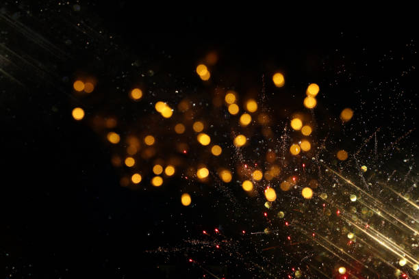 istock abstract glitter lights background. black and gold. de-focused 1148392212