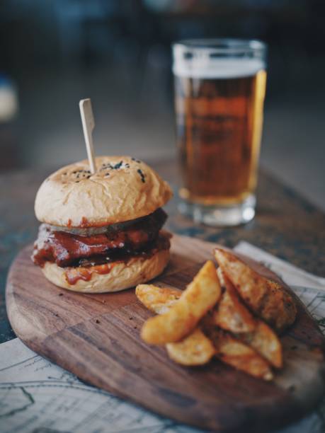 istock Meat burger with beer in cafe 1148393406