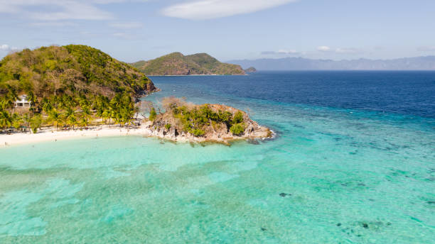 istock Lagoon with a white beach. Tourists relax on the beach 1148396702