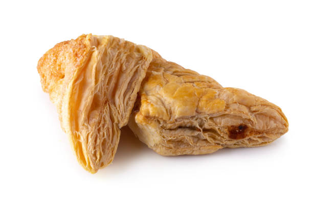 istock Puff pastry buns isolated over white background. 1148397595