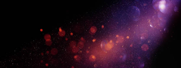 istock abstract glitter lights background. red, black, purple and gold. de-focused. banner 1148399331