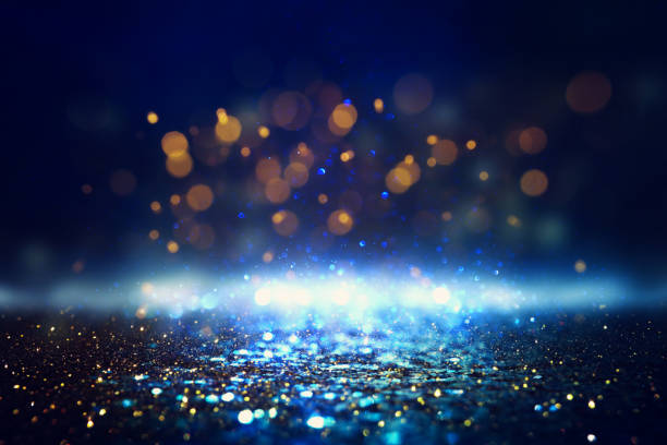 istock glitter vintage lights background. black, blue, gold and silver. de-focused 1148399343