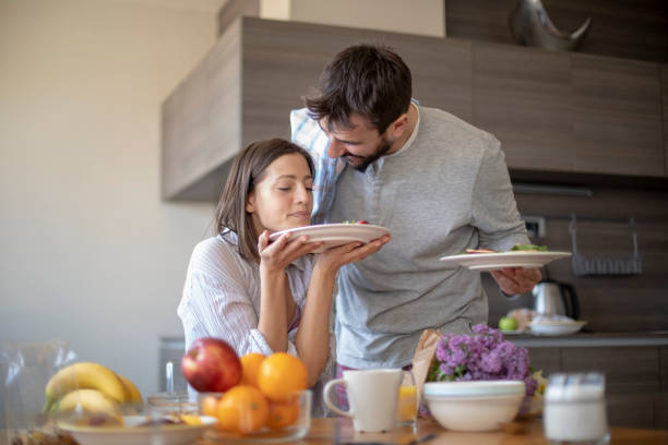 istock Young couple having vegan breakfast in dining room 1148404418