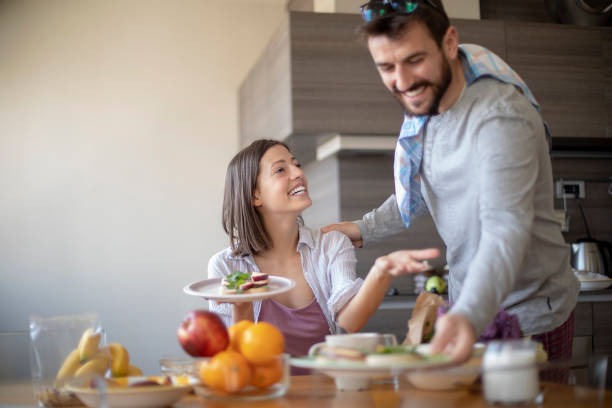 istock Young couple having vegan breakfast in dining room 1148404422