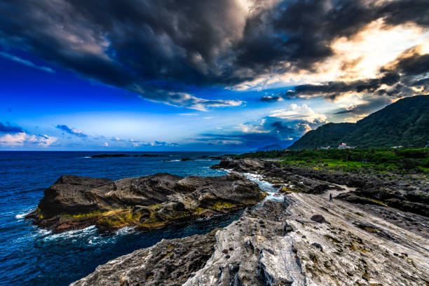 Rock formations and stormy skies in a beautiful winter dusk, in Hualian, Taiwan