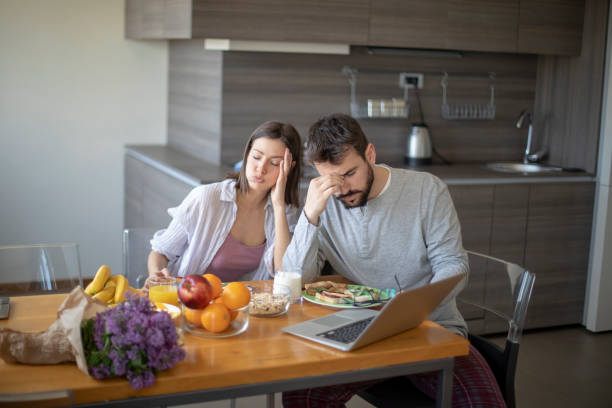 istock Young couple having vegan breakfast in dining room 1148406333