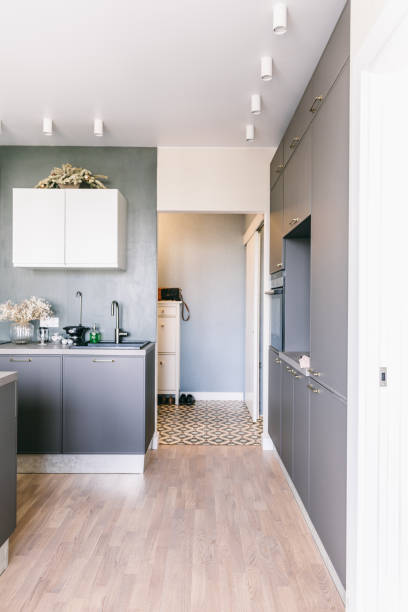 istock Scandinavian interior design. White grey yellow green color kitchen room organization 1148409504