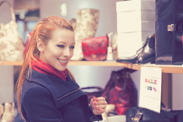istock young woman shopping for new clothes 1148409718