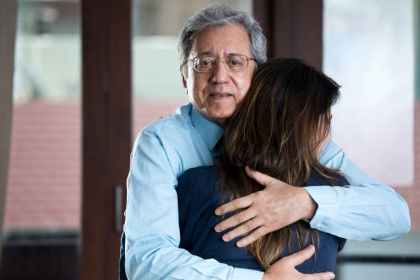 istock Woman sharing a moment with senior father 1148410468