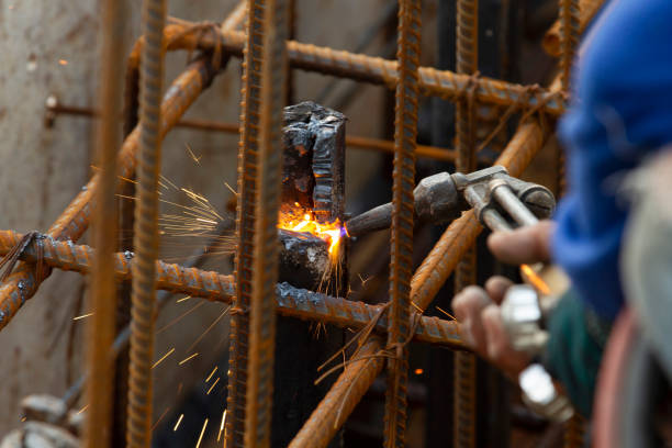 istock Welder worker during perform cutting steel with fire sparks 1148411155