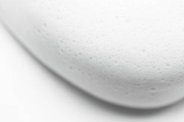 Smooth foam soap form abstract background with selective focus. Close up, macro stock photo