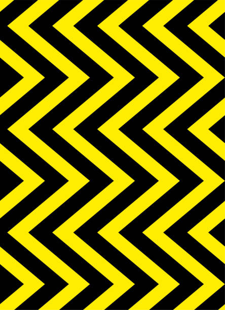 Seamless black and yellow zigzag stripes pattern. Vector design Seamless black and yellow zigzag stripes pattern. Geometric repeating pattern of zigzag. Vector and illustration background design. road chevron warning signs stock illustrations