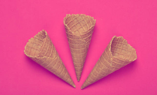 istock Empty waffle horns on a pink background. Top view, creative background, minimalist trend 1148421445