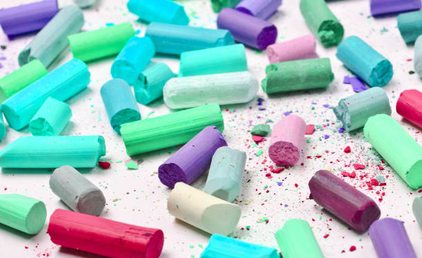 istock Many multicolored pastel crayons on a white background 1148422877