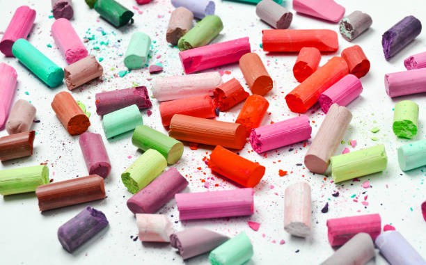 istock Many multicolored pastel crayons on a white background 1148422879