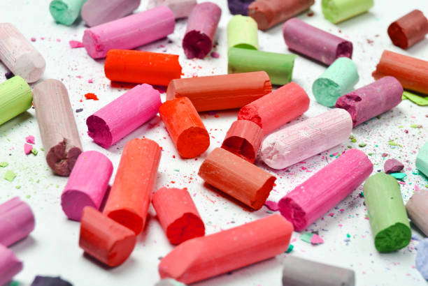 istock Many multicolored pastel crayons on a white background 1148422882