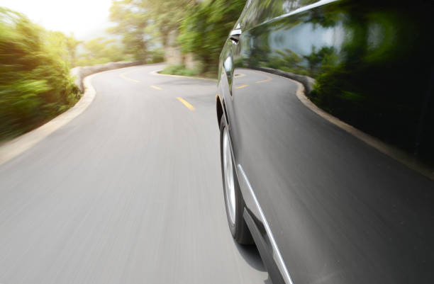 istock Black car driving fast on a mountain road 1148423791