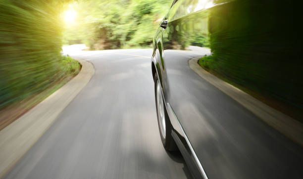 istock Black car driving fast on a mountain road 1148423826