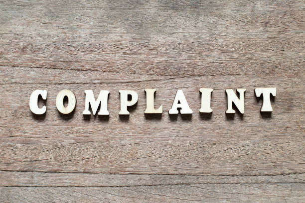 istock Letter block in word complaint on wood background 1148424302