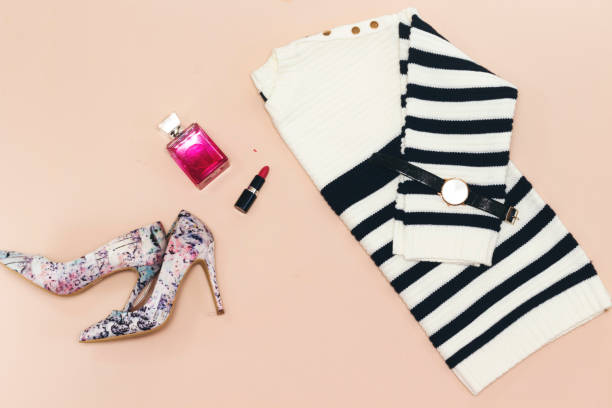istock zebra pullover, pair pump shoes and  red lipstick, perfume bottle  on pink background 1148427036