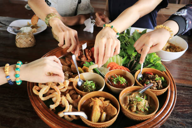 istock Many hands are picking up food. 1148430309