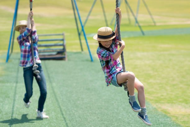 Mother and daughter playing in the park